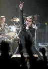 Lead singer Bono and drummer Larry Mullen (L) of the Irish rock group U2 kick off the band's world tour 'Vertigo' with their opening show in San Diego, California March 28, 2005. The Irish rock band has sold over 2.2 million tickets and grossed some $185 million with advance ticket sales. By the time U2's Vertigo concludes, it will be one of the top-grossing rock tours of all time, with a total nearing $300 million . REUTERS/Mike Blake