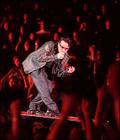 U2's lead singer and sometimes guitarist Bono is seen here getting in tune with the audience at Tuesday night's opening show at the FleetCenter. They also play Wednesday, Friday and Saturday, all of which are sold out. (Evan Richman / Globe Staff Photo) 
