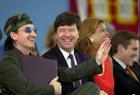 U2's Bono, left, laughs with Harvard economist Jeffrey D. Sachs, second left, and others after he received an honorary membership to the class of 2001 at Class Day ceremonies at Harvard University in Cambridge, Mass., Wednesday, June 6, 2001. (AP Photo/Elise Amendola)