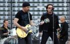 Bono, the lead singer for Irish rock band U2, right, and guitarist The Edge, left, perform during their concert at King Baudouin Stadium in Brussels, Friday June 10, 2005. U2 on Friday kicked of the first leg of their European 'Vertigo' tour in Brussels. (AP Photo/Geert Vanden Wijngaert)