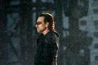 Bono pauses on stage as U2 perform their second song 'I Will Follow' at Croke Park stadium in Dublin, Ireland Friday June 24, 2005. (AP Photo/Haydn West, PA)