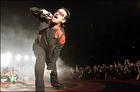 Rocking the crowd : Irish singer Bono of the band U2 performs during a concert at the Olympic Stadium in Rome as part of the band's 'Vertigo 2005' world tour. (AFP/Andreas Solaro)