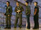 U2's Bono (L), Adam Clayton, The Edge and Larry Mullen (R) accept the Grammy Award for Best Rock Performance by a Duo or Group at the 44th Annual Grammy Awards in Los Angeles February 27, 2002. U2 won for their song 